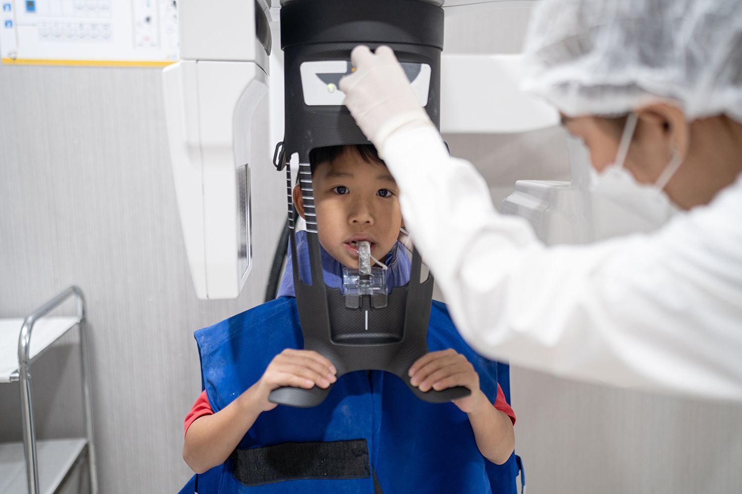 A Boy preparing for Dental X Ray