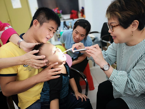 A young boy having his teeth checked