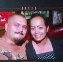 two people posing in front of a camera