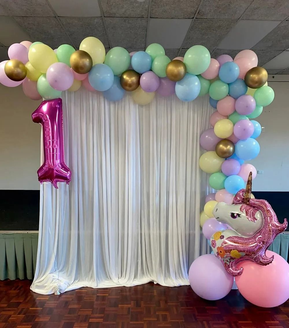 Birthday Party Backdrop With Pastel Balloons and a Unicorn Balloon — Creative Events Innisfail in Innisfail, QLD
