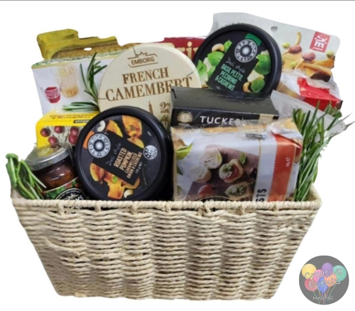 Gift Basket Filled With Cheese, Crackers, and Snacks — Creative Events Innisfail in Innisfail, QLD