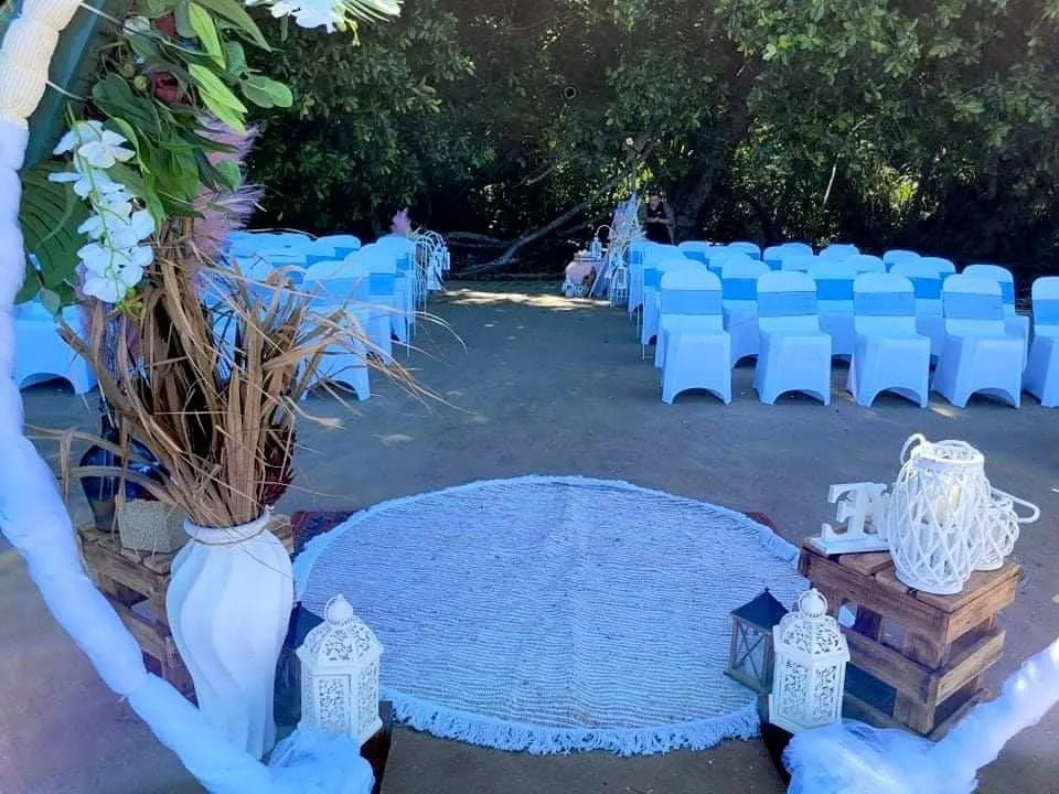 Wedding Ceremony Setup With White Chairs — Creative Events Innisfail in Innisfail, QLD
