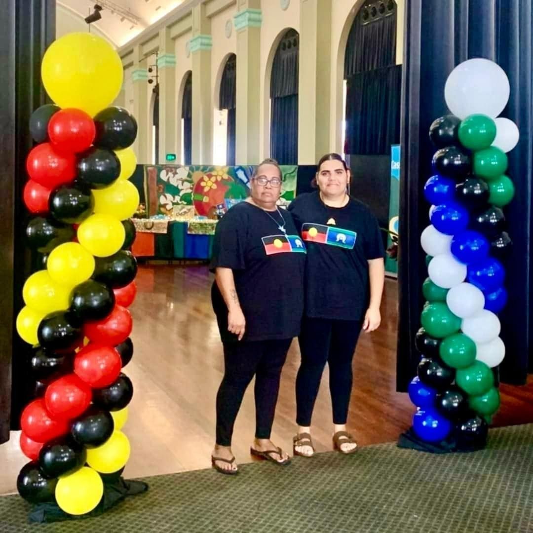 Two People Stand Between Balloon Columns — Creative Events Innisfail in Babinda, QLD