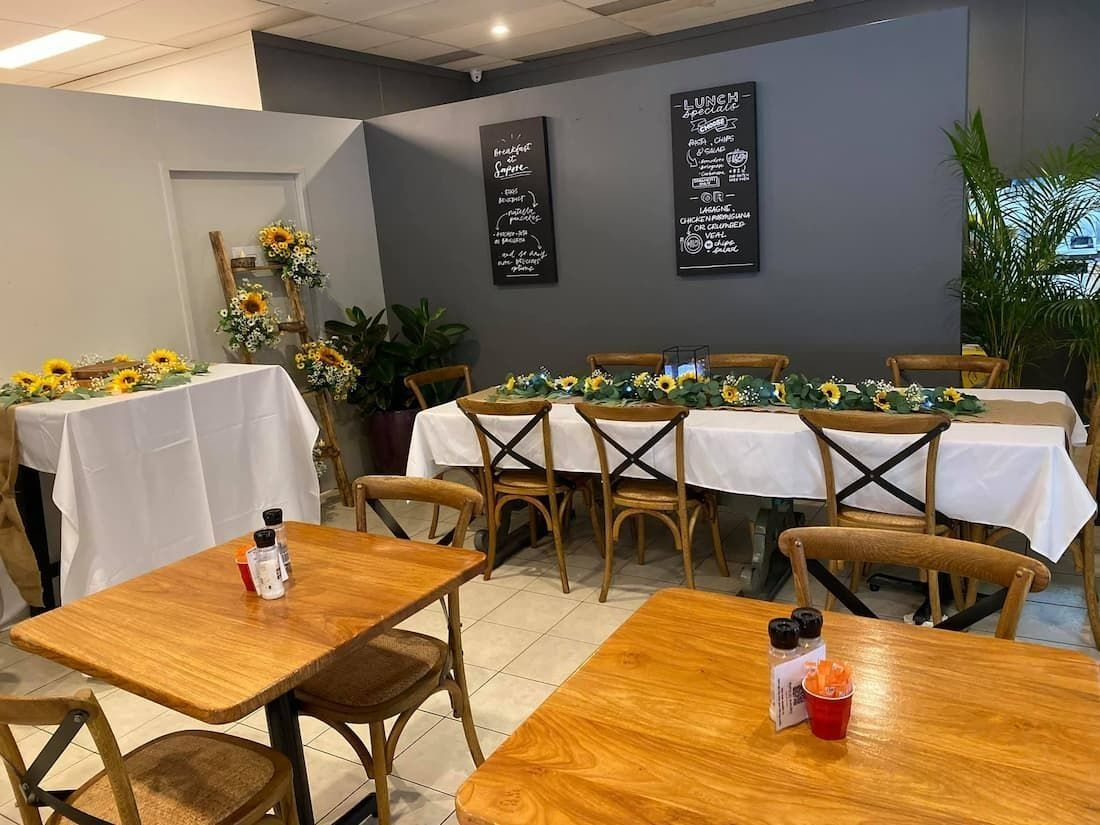 Restaurant Interior With Wooden Tables and Cross-back Chairs — Creative Events Innisfail in Innisfail, QLD