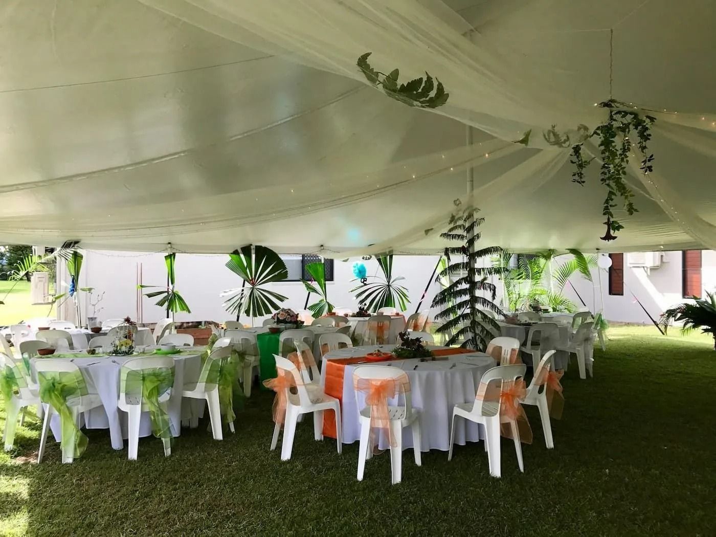White Tent-covered Party With Round Tables and White Chairs — Creative Events Innisfail in Mission Beach, QLD