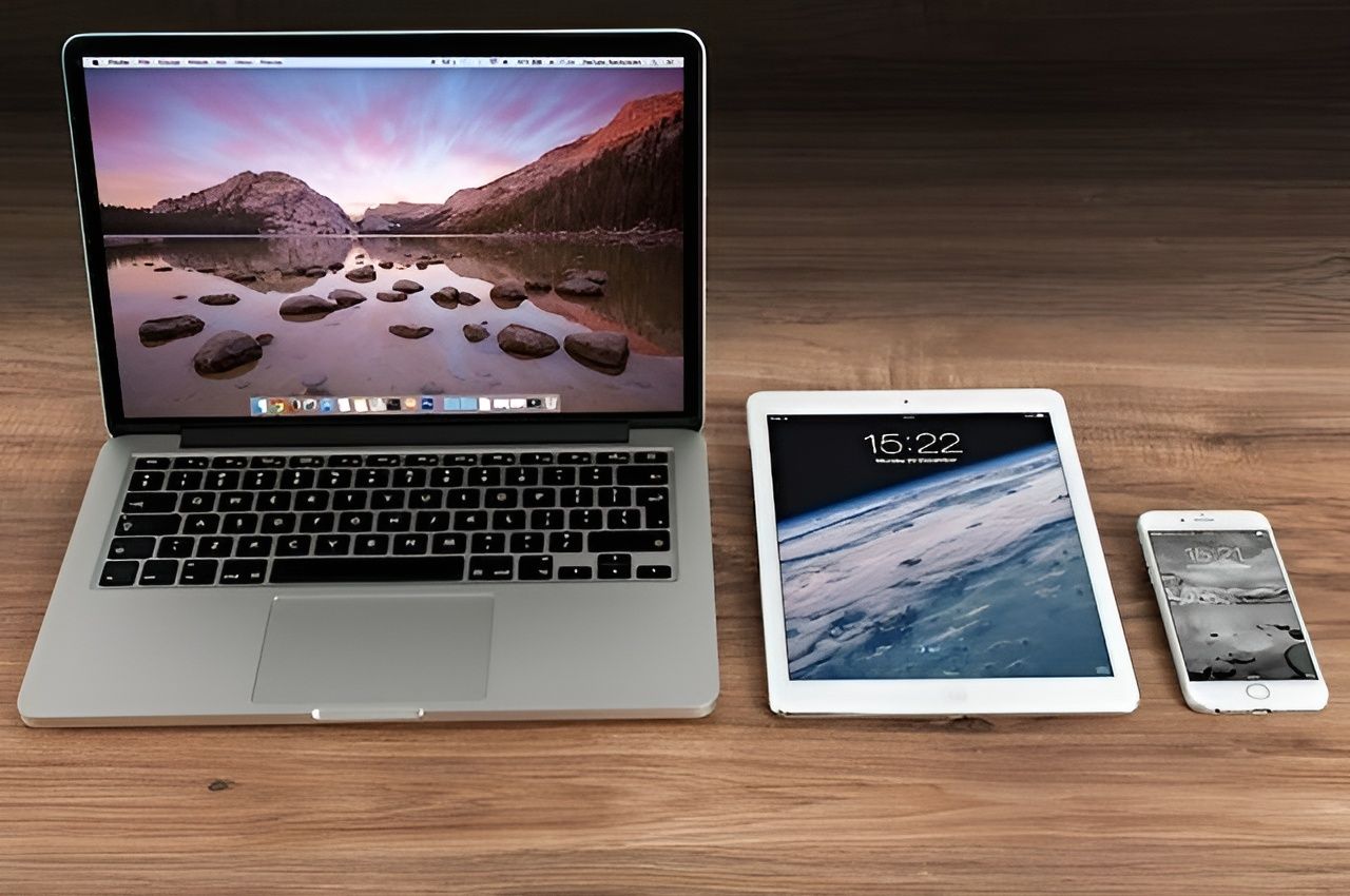 Laptop, Tablet, and Smartphone on A Wooden Surface, Displaying Different Screens — Wright Partners in Dubbo, NSW