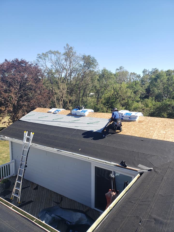 Roofer Putting Interwrap Titanium In The Roof — Norwalk, IA — Roofing Experts
