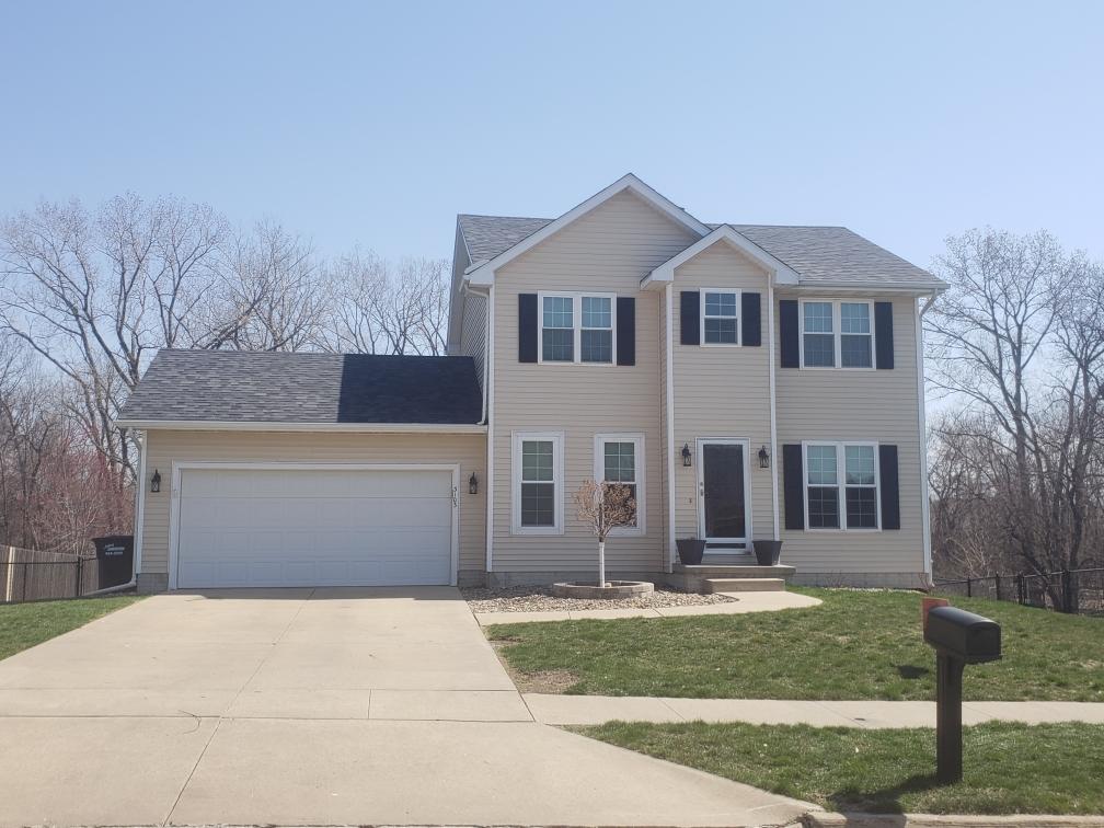 Cream Tainted House — Norwalk, IA — Roofing Experts