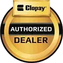 A circular gold Clopay Authorized Dealer badge featuring black text on a gold background.