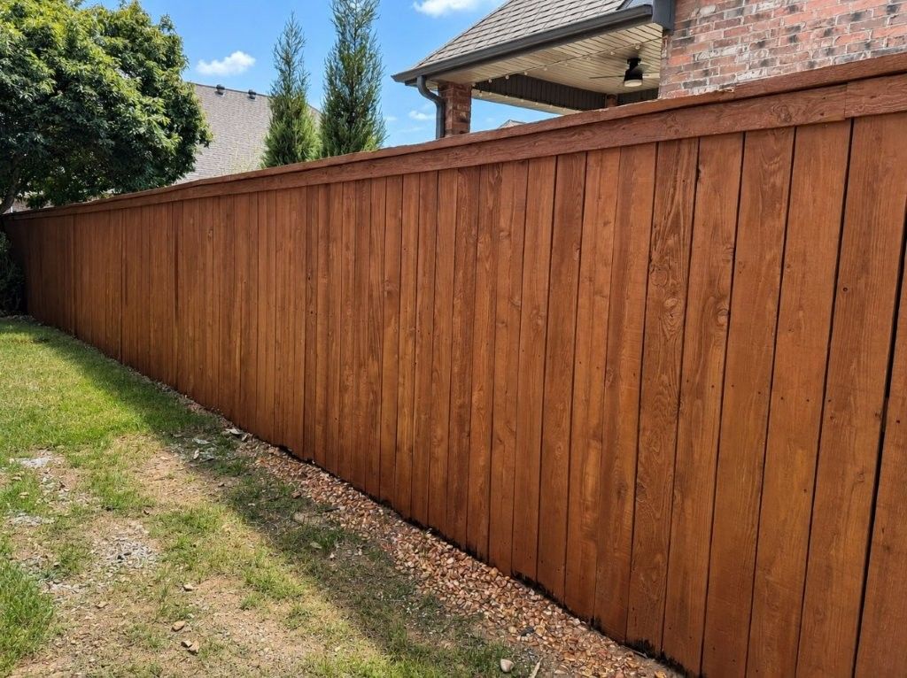 wood cedar fence with cap and trim stained