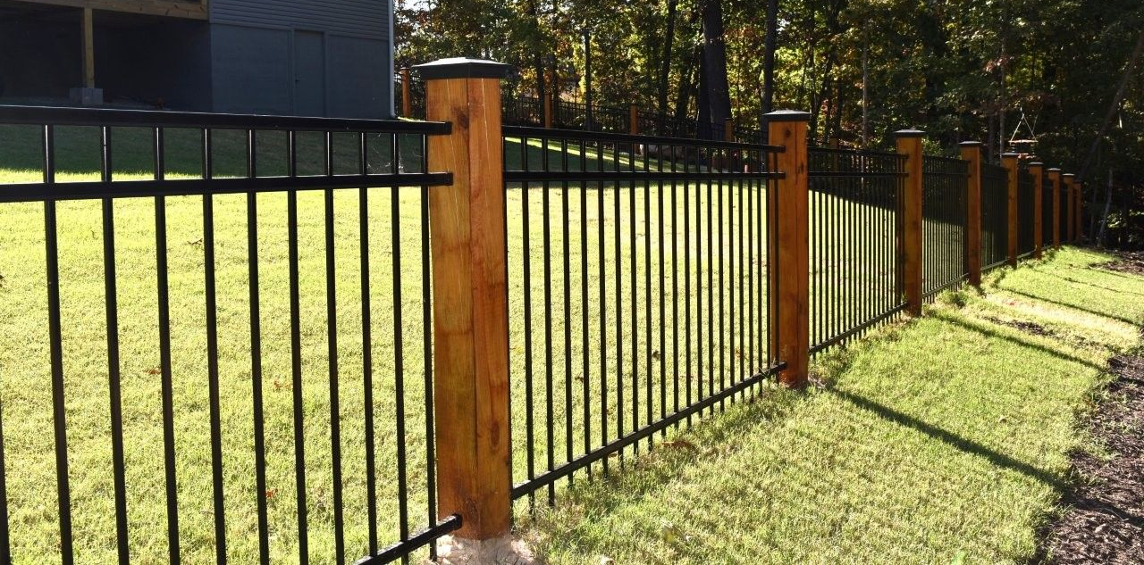 3 Rail iron fence with wood posts