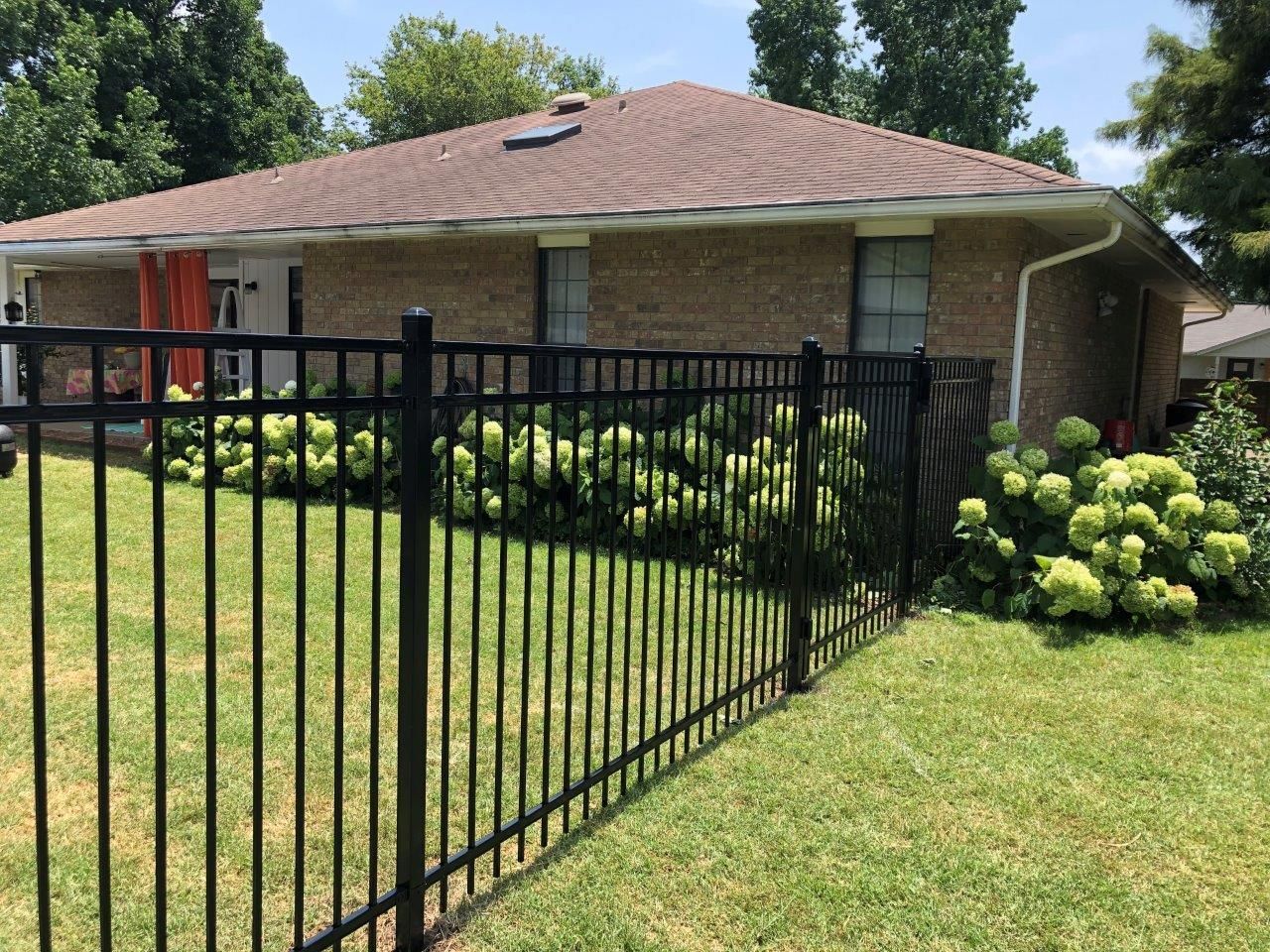 4 foot 3 rail smooth top ornamental iron fence installation in Bentonville Arkansas
