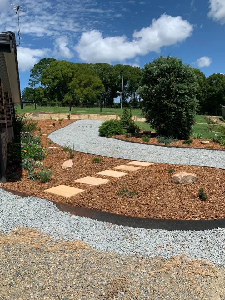 A Curved Gravel Path Winds Through a Landscaped Yard — Creative Landscapes Coffs Harbour in Sandy Beach, NSW