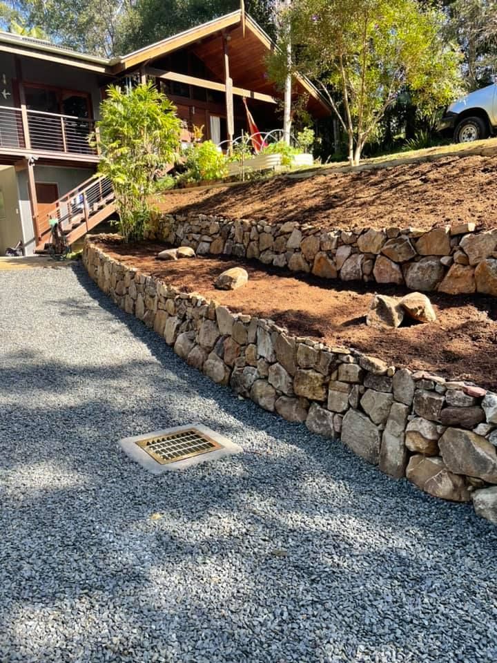 A Tiered Stone Retaining Wall — Creative Landscapes Coffs Harbour in Bellingen, NSW