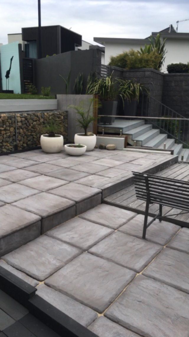 A Tiered Patio Featuring Large Grey Pavers — Creative Landscapes Coffs Harbour in Moonee Beach, NSW