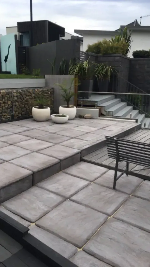 A Tiered Concrete Patio with Square Pavers  — Creative Landscapes Coffs Harbour in Korora, NSW