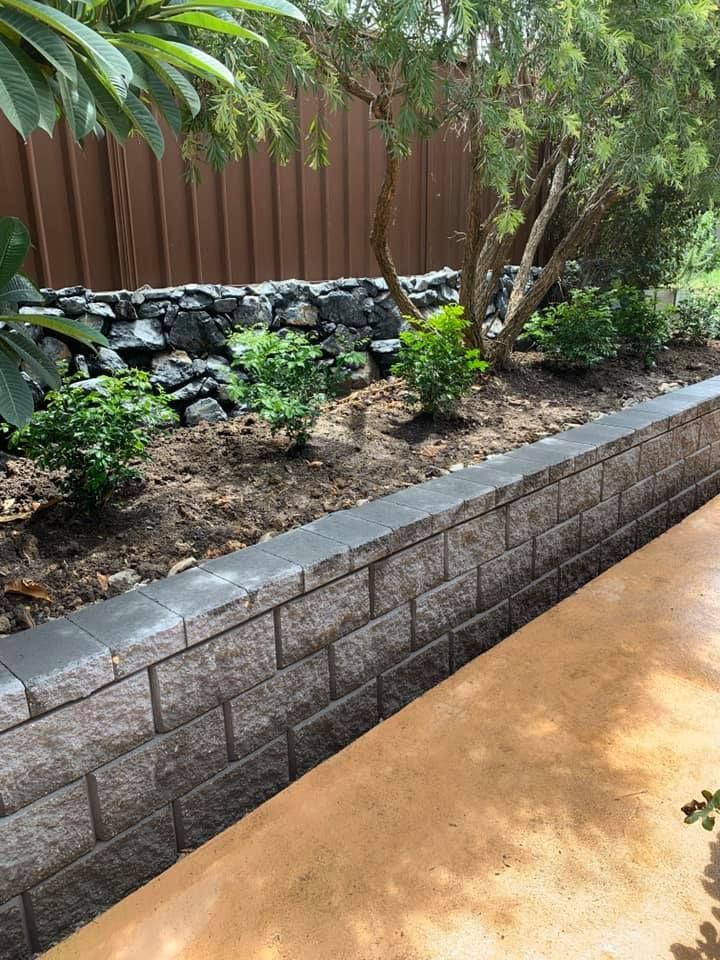 A Retaining Wall Made of Grey Concrete Blocks — Creative Landscapes Coffs Harbour in Woolgoolga, NSW