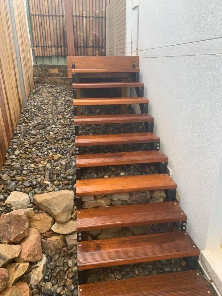 A Wooden Outdoor Staircase with Dark Metal Framing  — Creative Landscapes Coffs Harbour in Korora, NSW