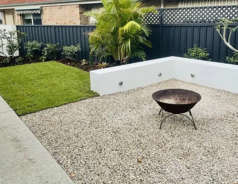 A Gravel Patio Featuring a Round Fire Pit  — Creative Landscapes Coffs Harbour in Korora, NSW