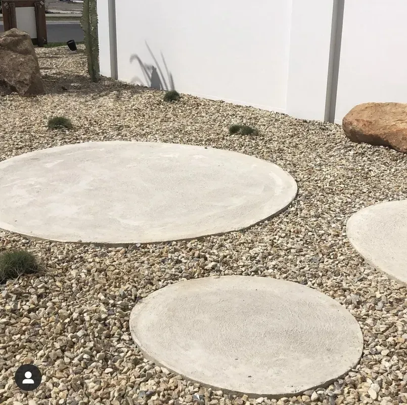 Large Circular Concrete Pavers Set Into a Gravel Garden Bed — Creative Landscapes Coffs Harbour in Korora, NSW