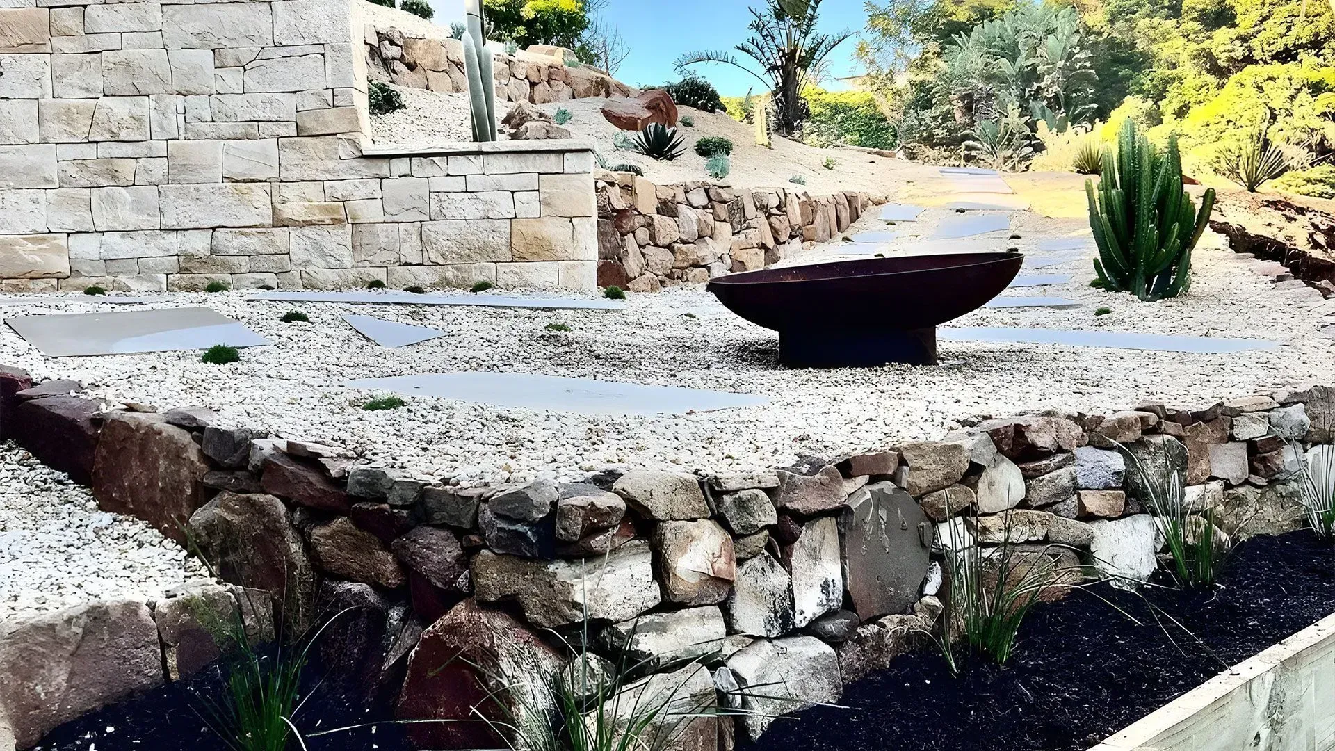 A Tiered Xeriscape Garden with Stone Retaining Walls — Creative Landscapes Coffs Harbour in Korora, NSW