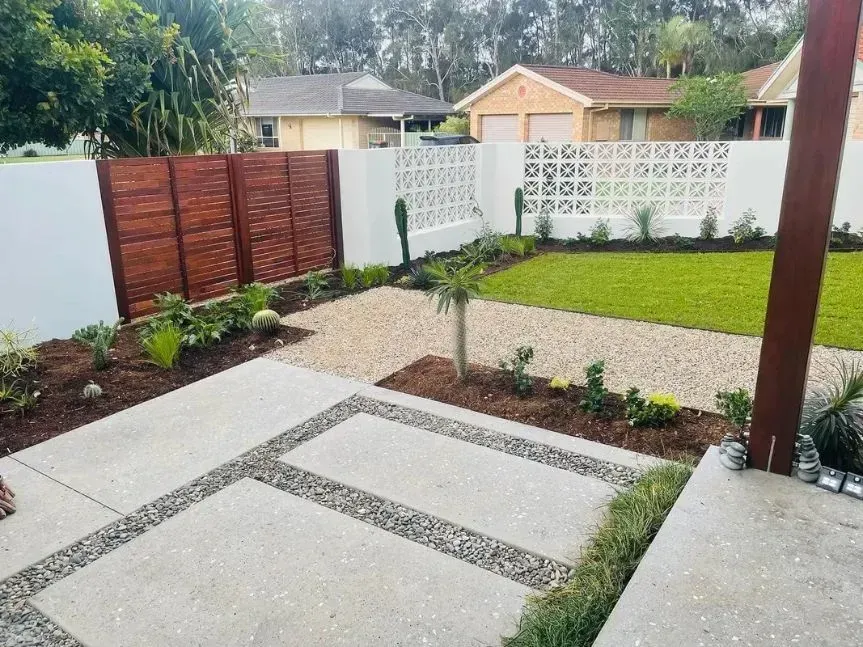Modern Backyard with A Concrete Patio  — Creative Landscapes Coffs Harbour in Korora, NSW