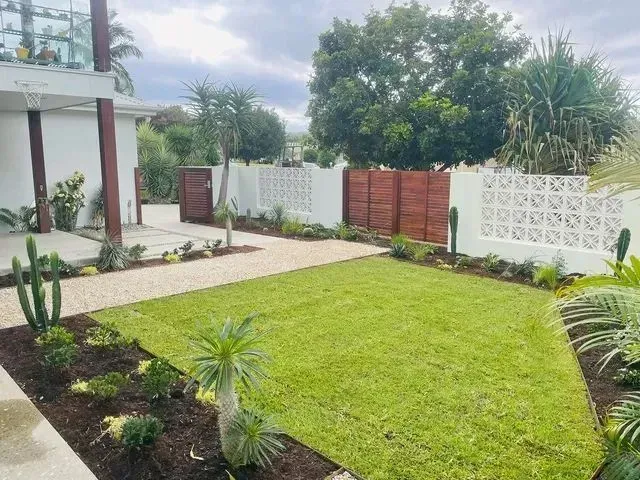 A Well-Manicured Lawn with Desert Plants — Creative Landscapes Coffs Harbour in Sapphire Beach, NSW