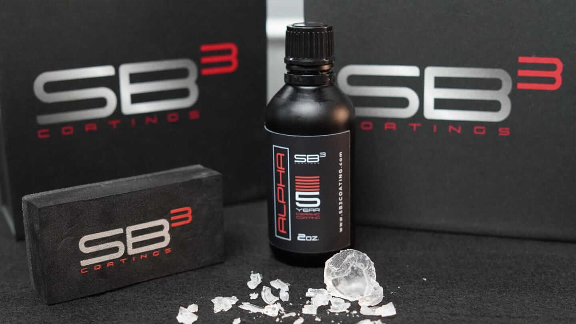 A bottle of sb3 coatings sits on a table