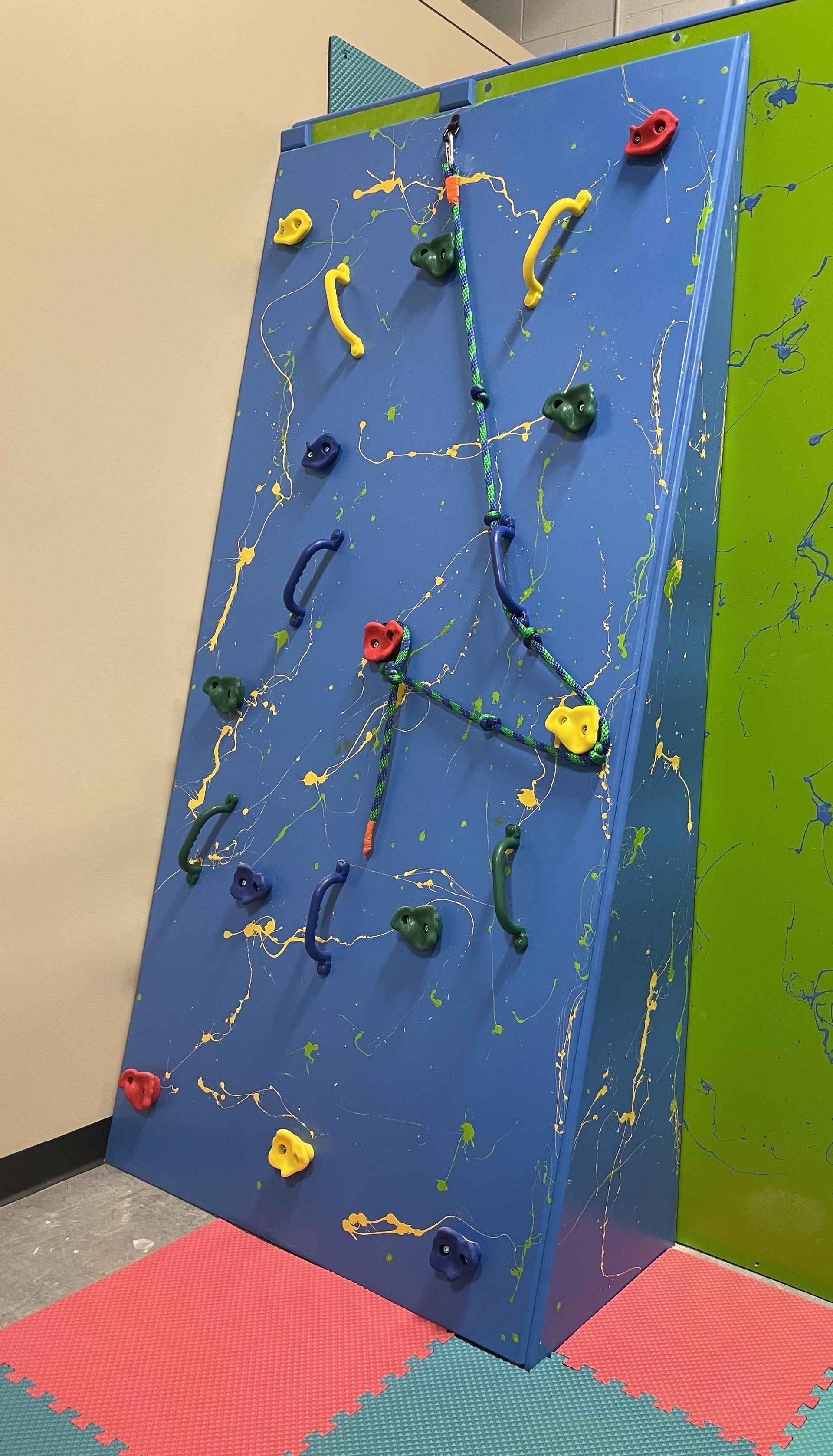 Custom angled sensory gym rock wall