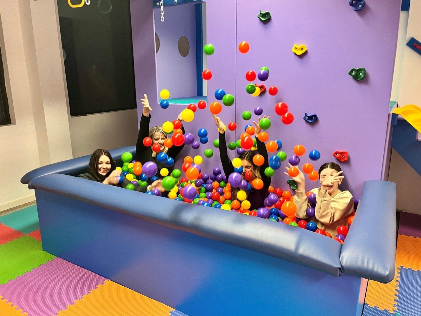 Custom sensory gym ball pit with padded perimeter