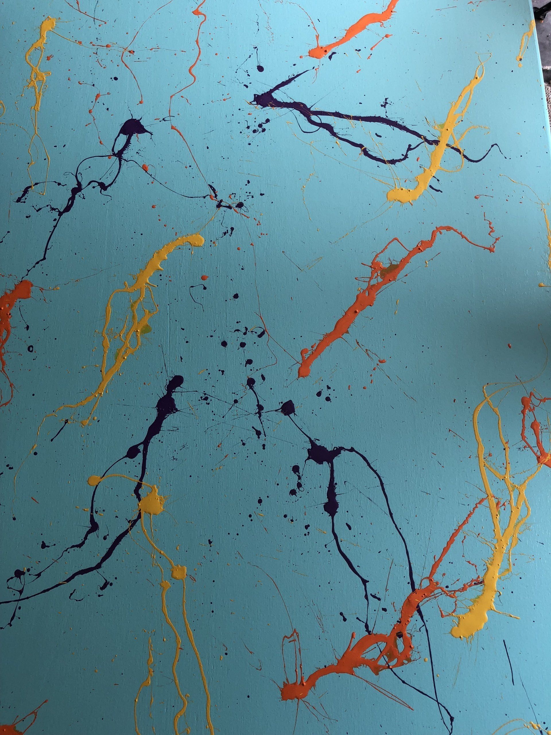 Decorative blue sensory room wall panel with colorful abstract paint splatter design