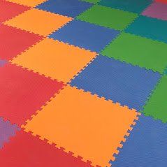 Multi-colored sensory gym foam flooring with cushioned tiles for safer movement, play, and therapy activities