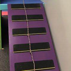 Custom ninja ramp with rope for a sensory gym