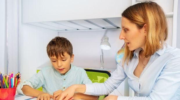 Child working with a therapist during a sensory-friendly learning and therapy activity