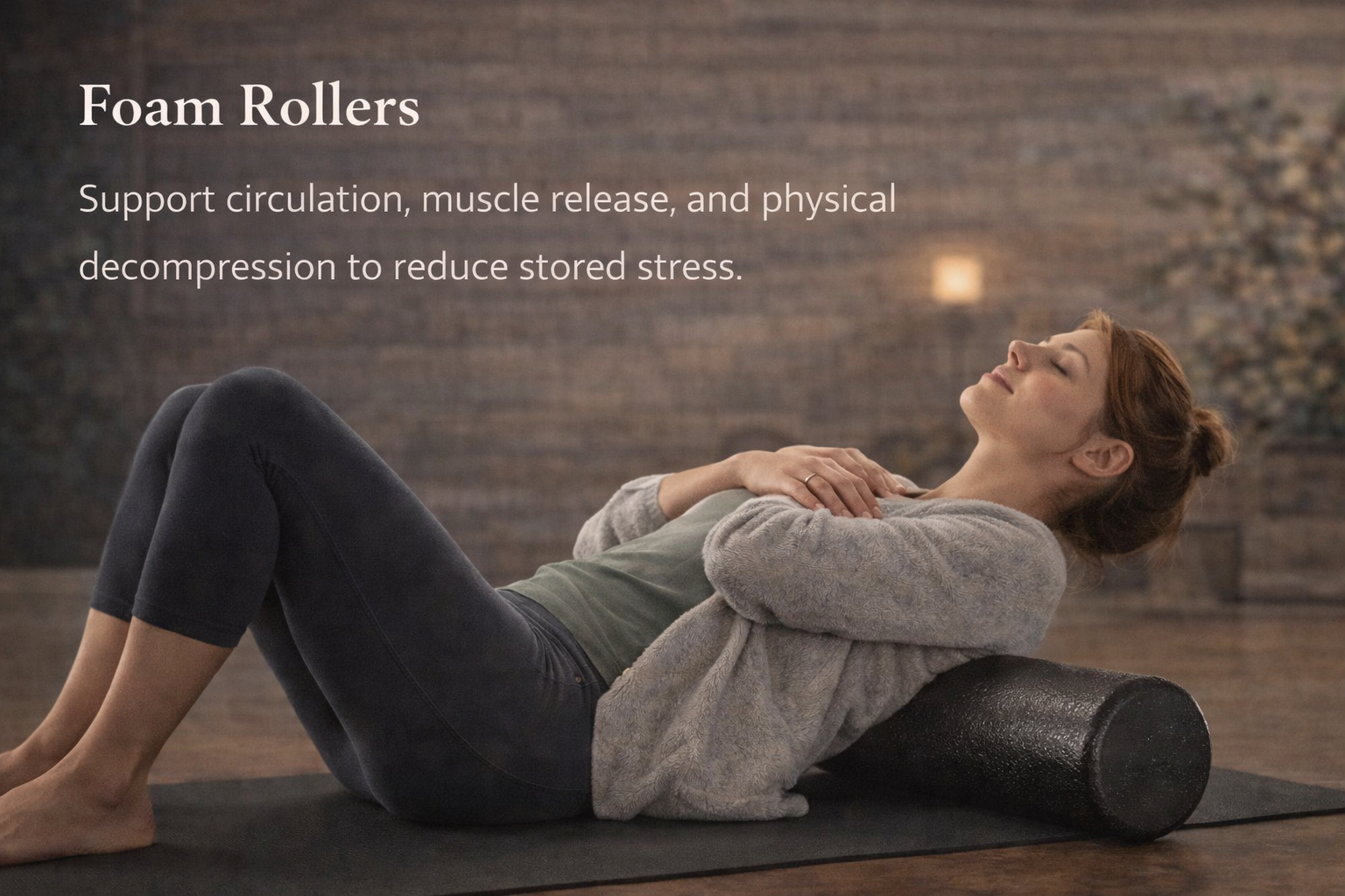 Woman reclining on a black foam roller in a studio with text about foam rollers and muscle relief
