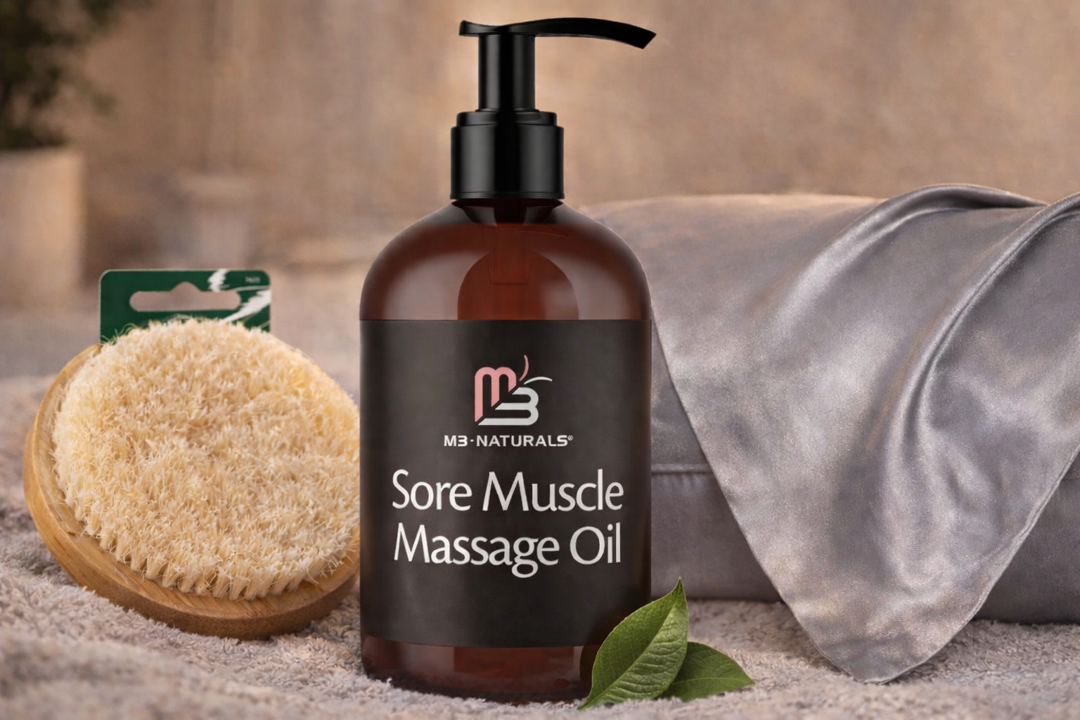 Sore muscle massage oil bottle beside a loofah and towel on a spa surface