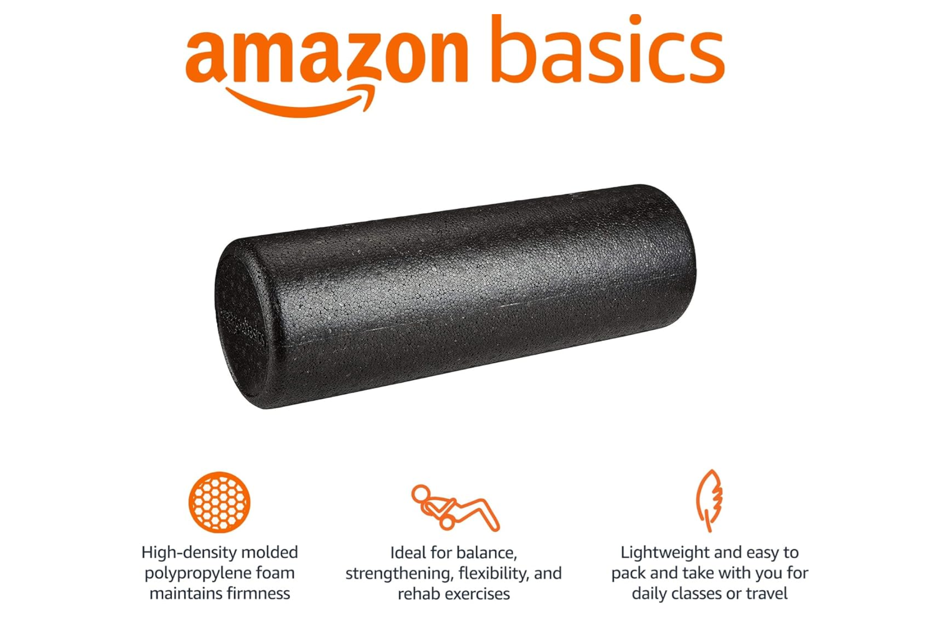 Black Amazon Basics foam roller on a white background.
