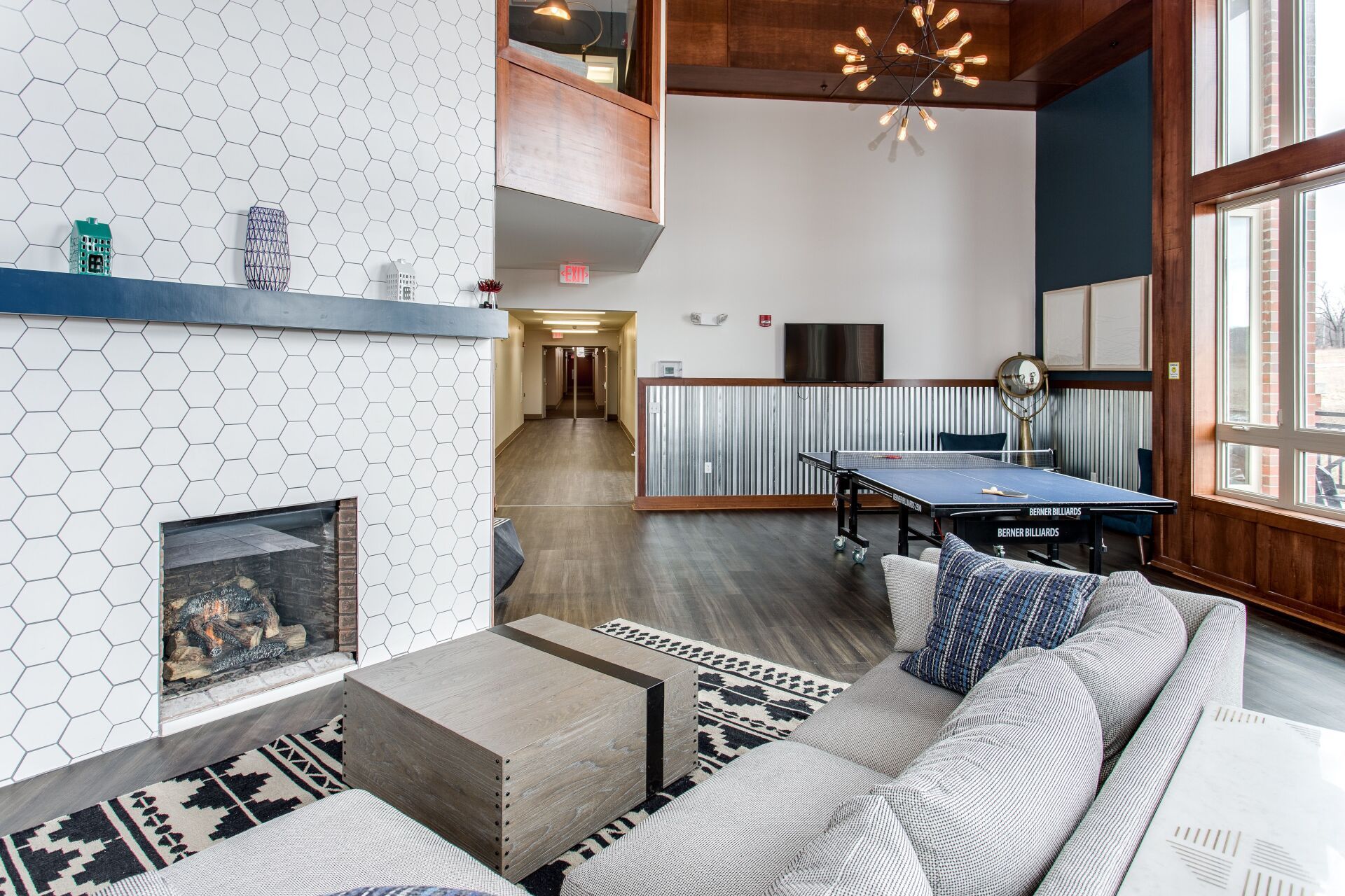 Game room with fireplace and ping pong table