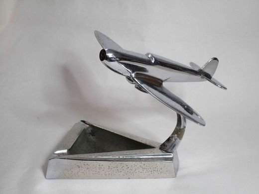 A triangular chrome ashtray with a Spitfire detail. Original condition