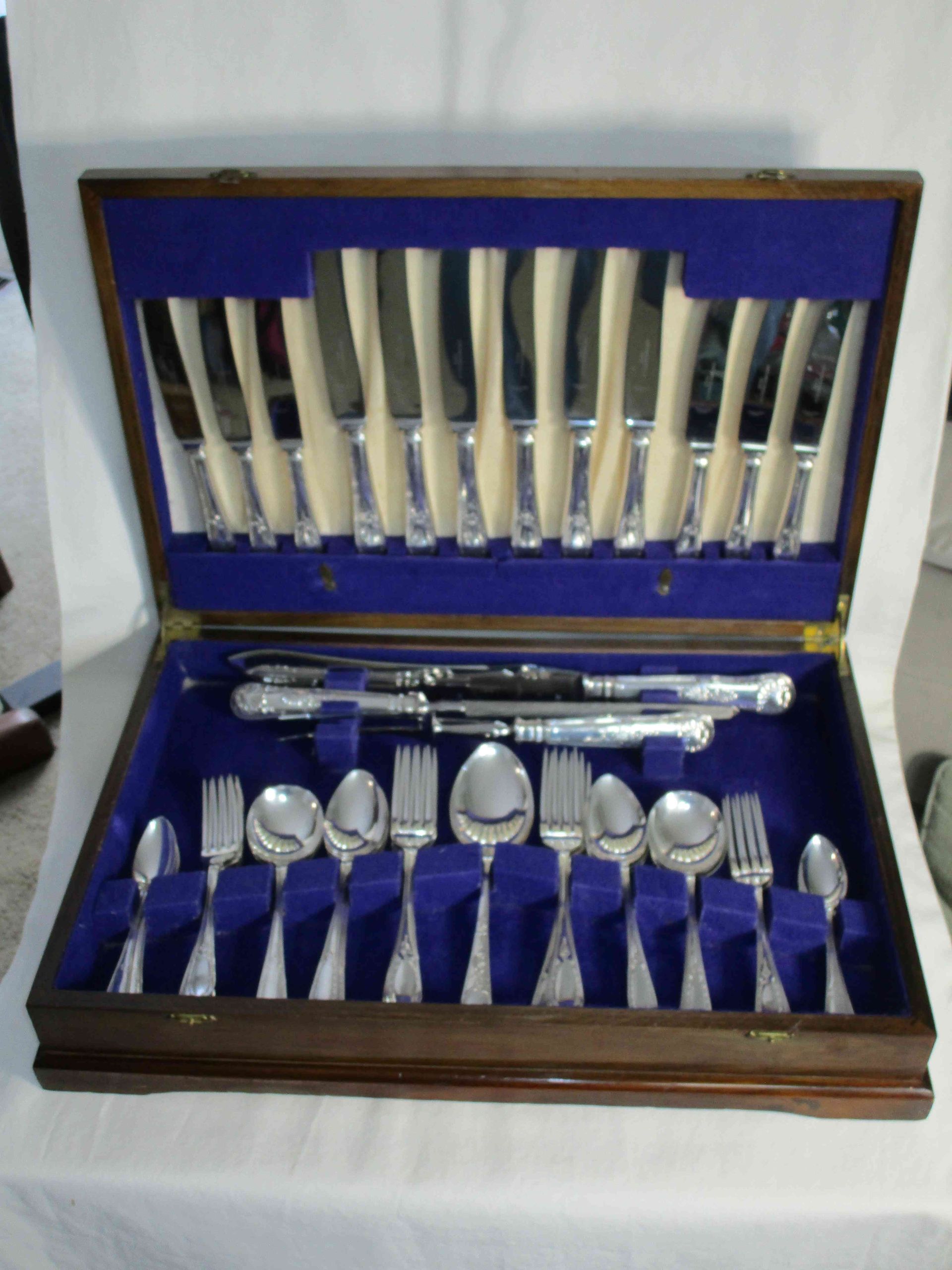 A canteen of silver plated cutlery by Slack & Barlow (Sheffield) Ltd. King's pattern. Setting for six with a carving knife, fork and sharpening steel