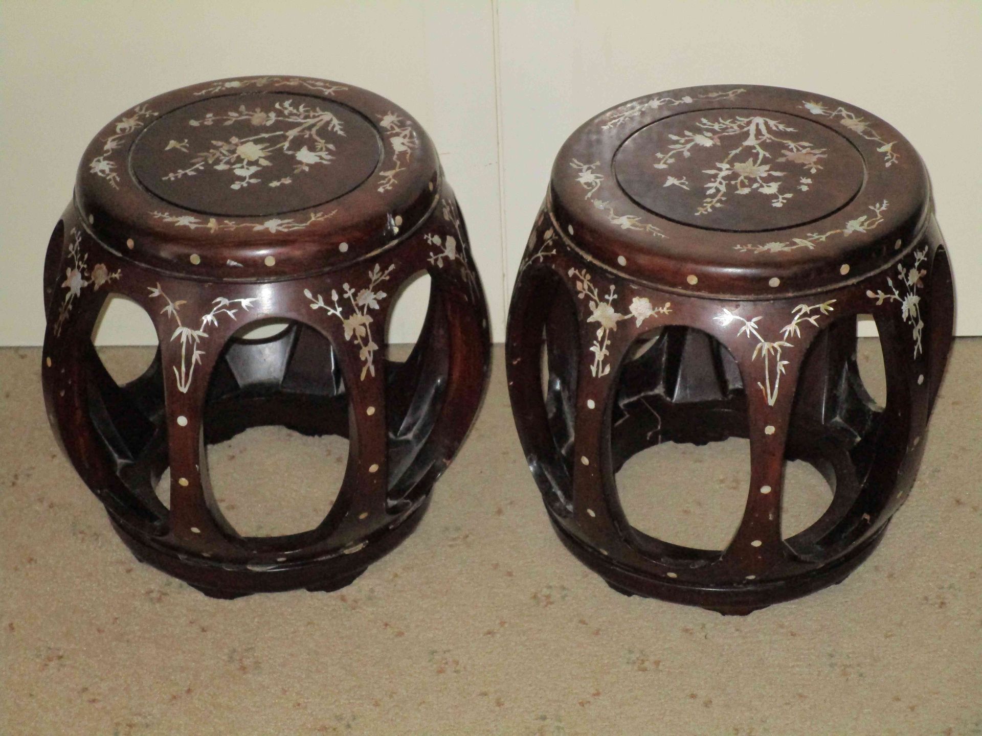 A pair of Chinese stools in the open drum shape with beautiful floral mother-of-pearl detail