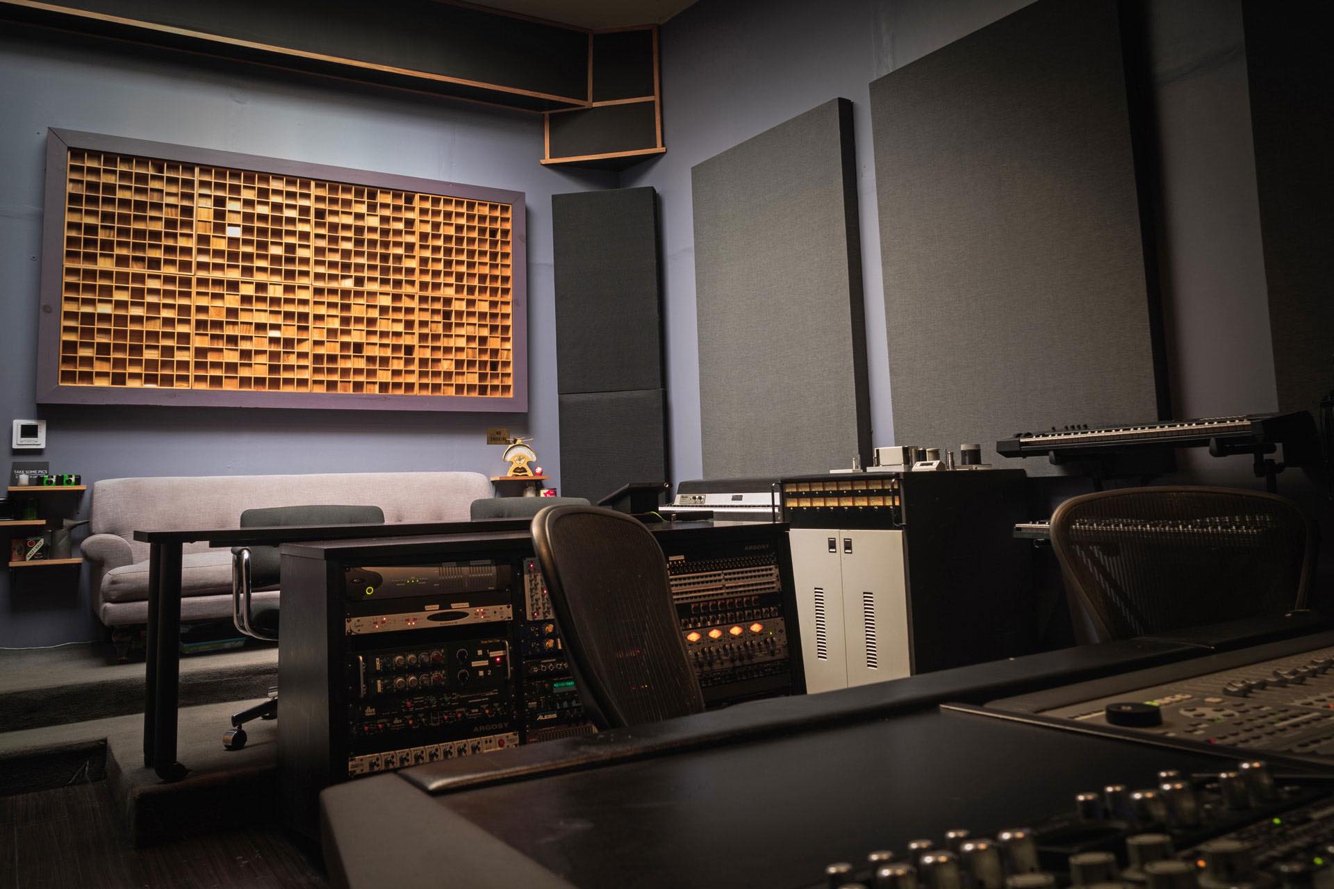 Modern soundproof studio with acoustic panels and quiet barriers for sound absorption.