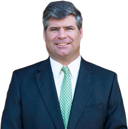 Smiling man in a dark suit, white shirt, and light green tie against a white background