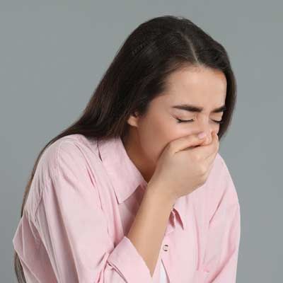 a woman wth Gastroenteritis throwing up