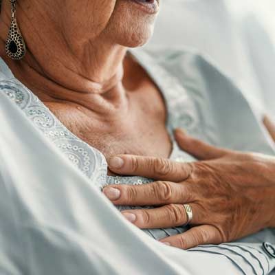 elderly woman suffering from GERD