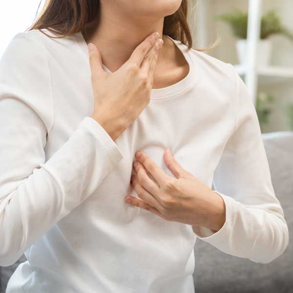 Woman needing GERD remedies in Kingston, NY - Dr. Louis Granirer, Holistic Chiropractor