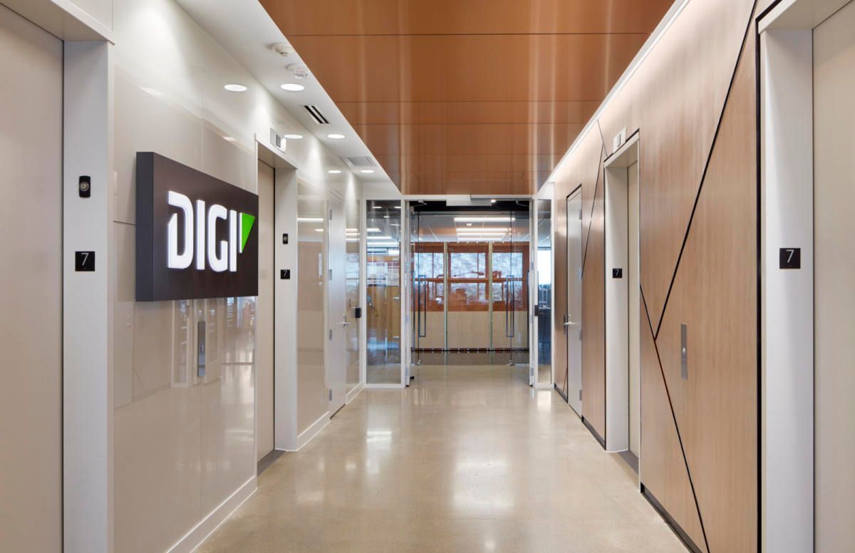 A long hallway with a sign that says digi on the wall.