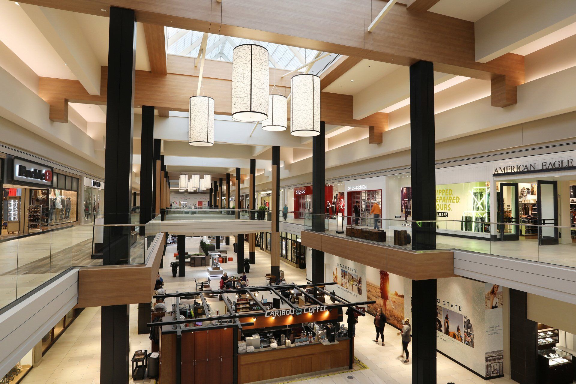 A large shopping mall with lots of shops and people