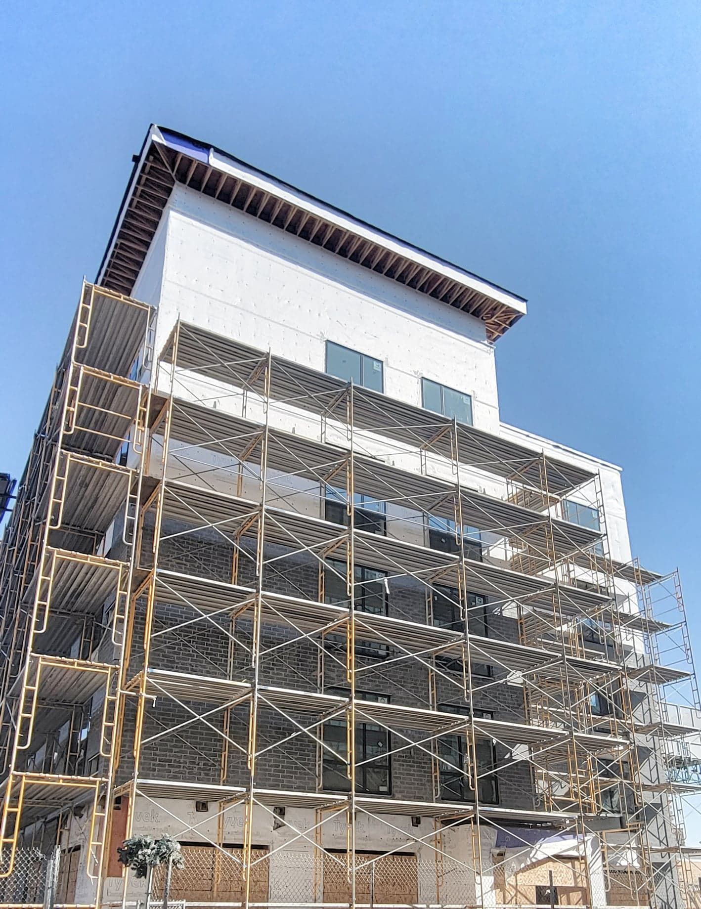 A Large Building Under Construction With Scaffolding Around It