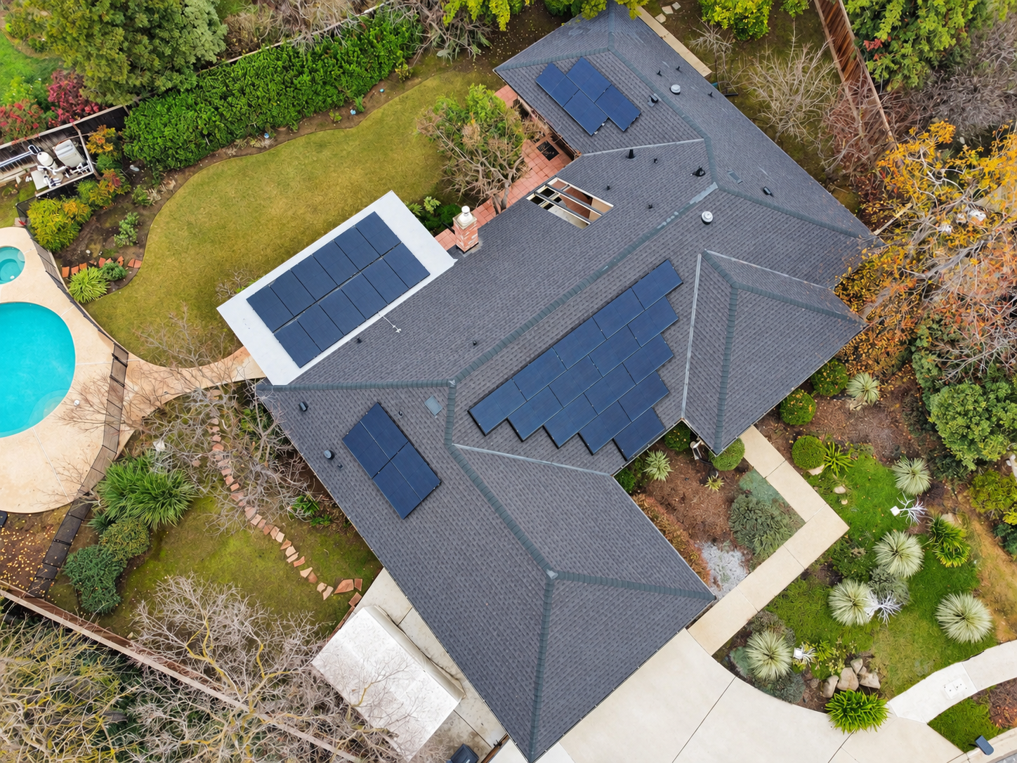 Aerial view of a home with rooftop solar panels, from Nova West Energy’s project library